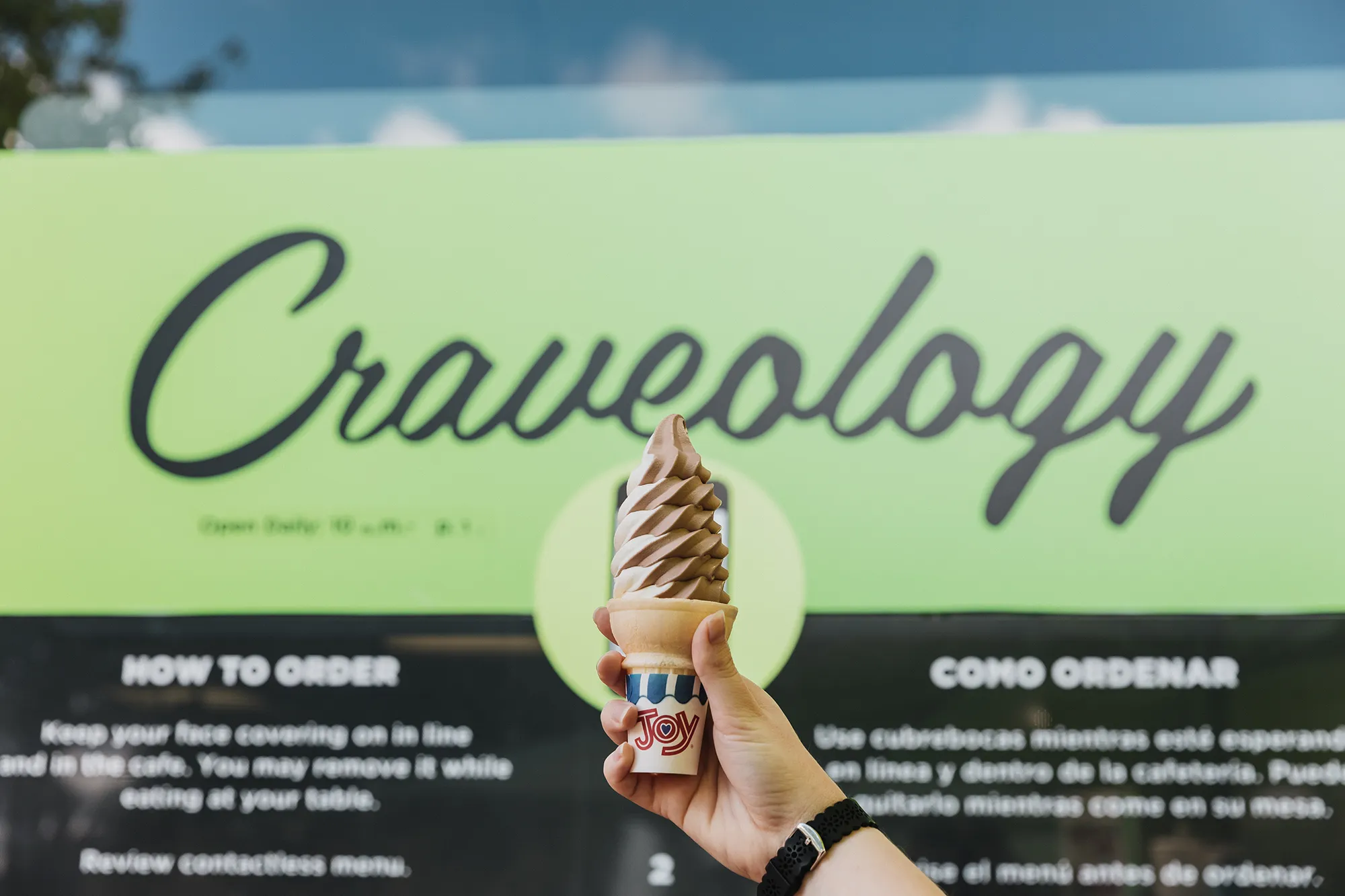 Craveology sign with ice cream in front of it