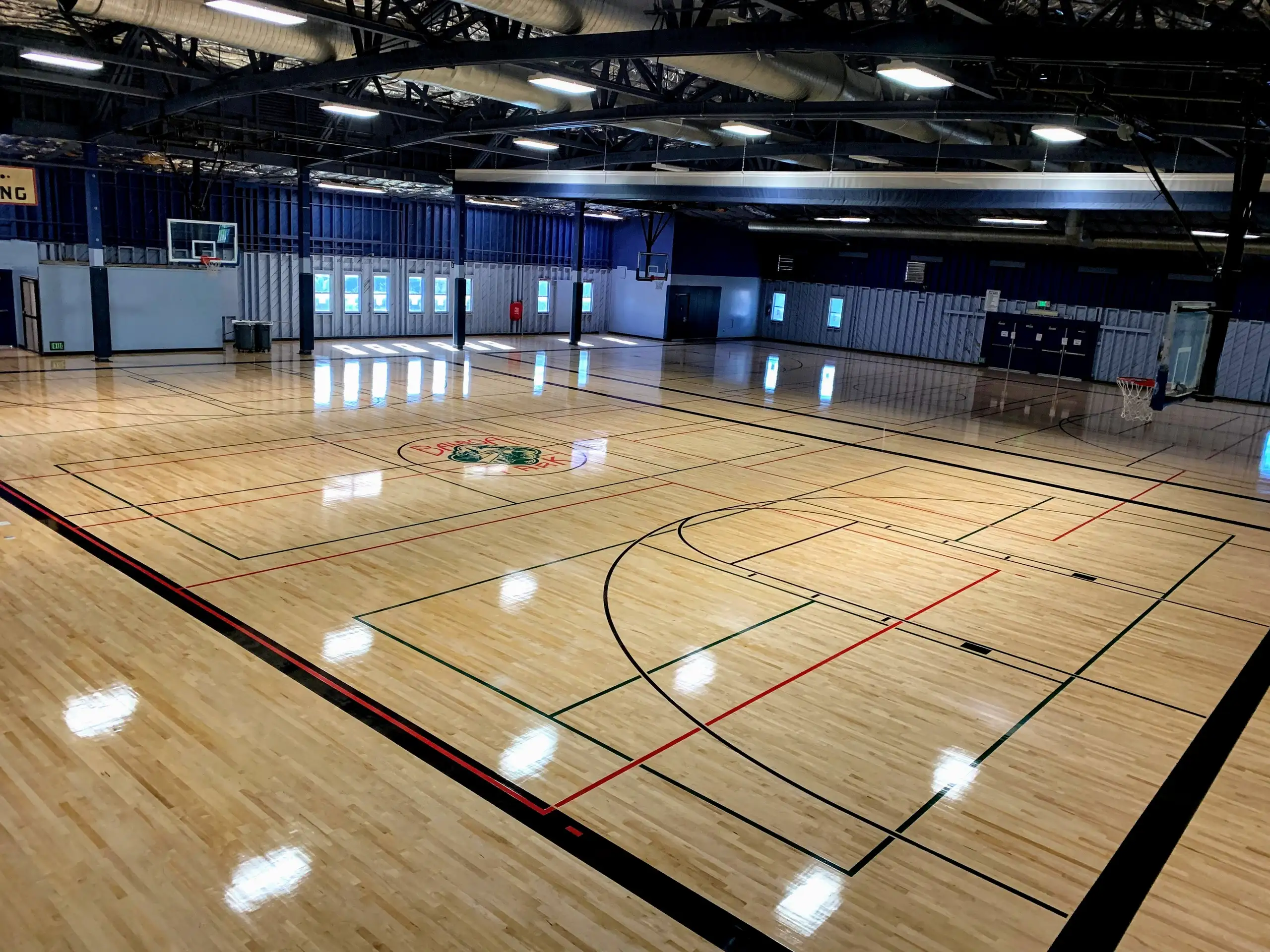 An interior view of the municipal gym with a basketball court.
