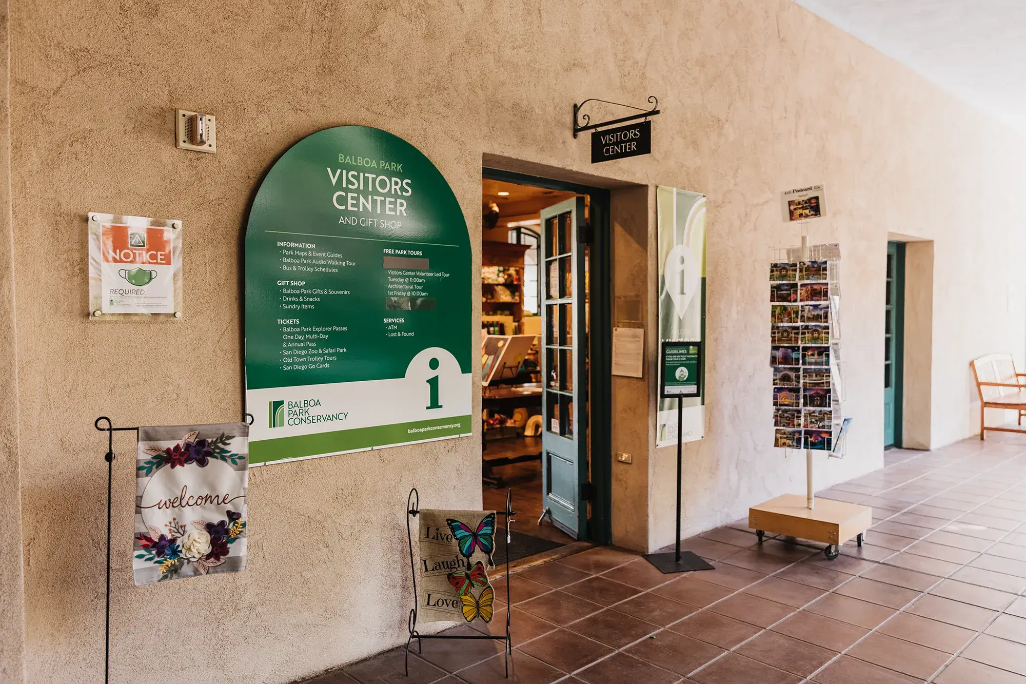 Visitors Center entrance with green Visitors Center sign