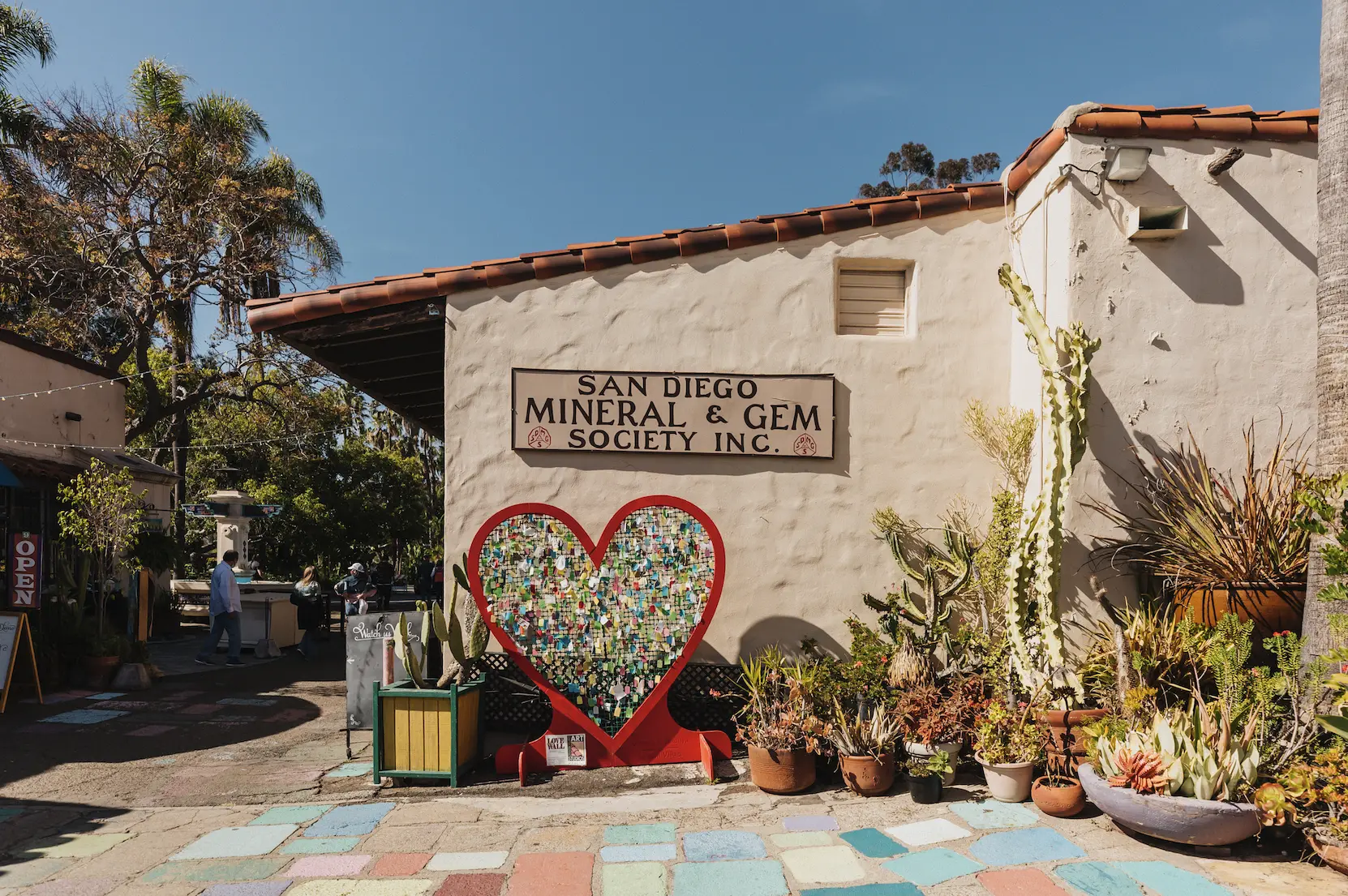 San Diego Mineral and Gem Society building. The building is off white with a red terracotta roof.