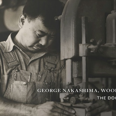 Black and white image of a man doing woodwork