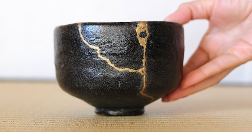 black pot with gold filling cracks