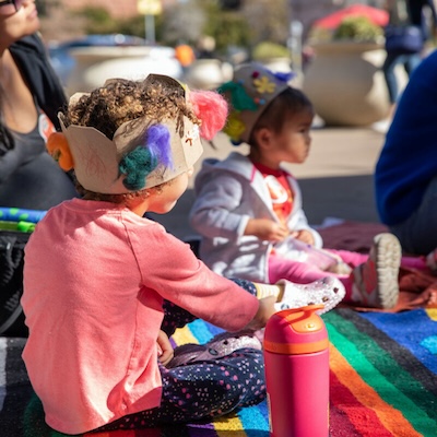 Kids doing crafts in a paper crown