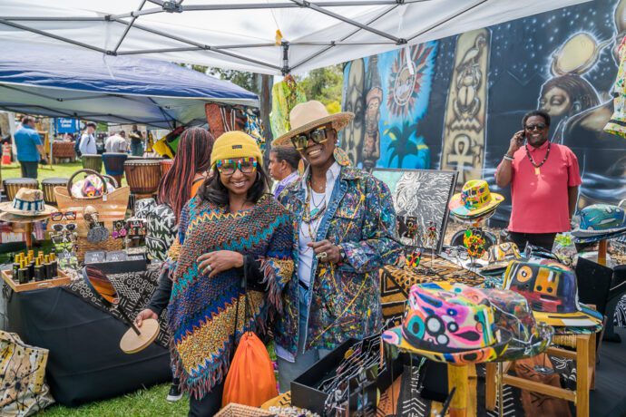 People standing inside booth
