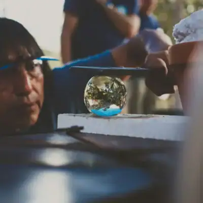 Person looking at a clear glass ball